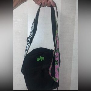 Stylish Black Crossbody Bag with Pink Strap